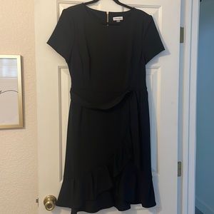 Black dress. Faux wrap ruffle look
